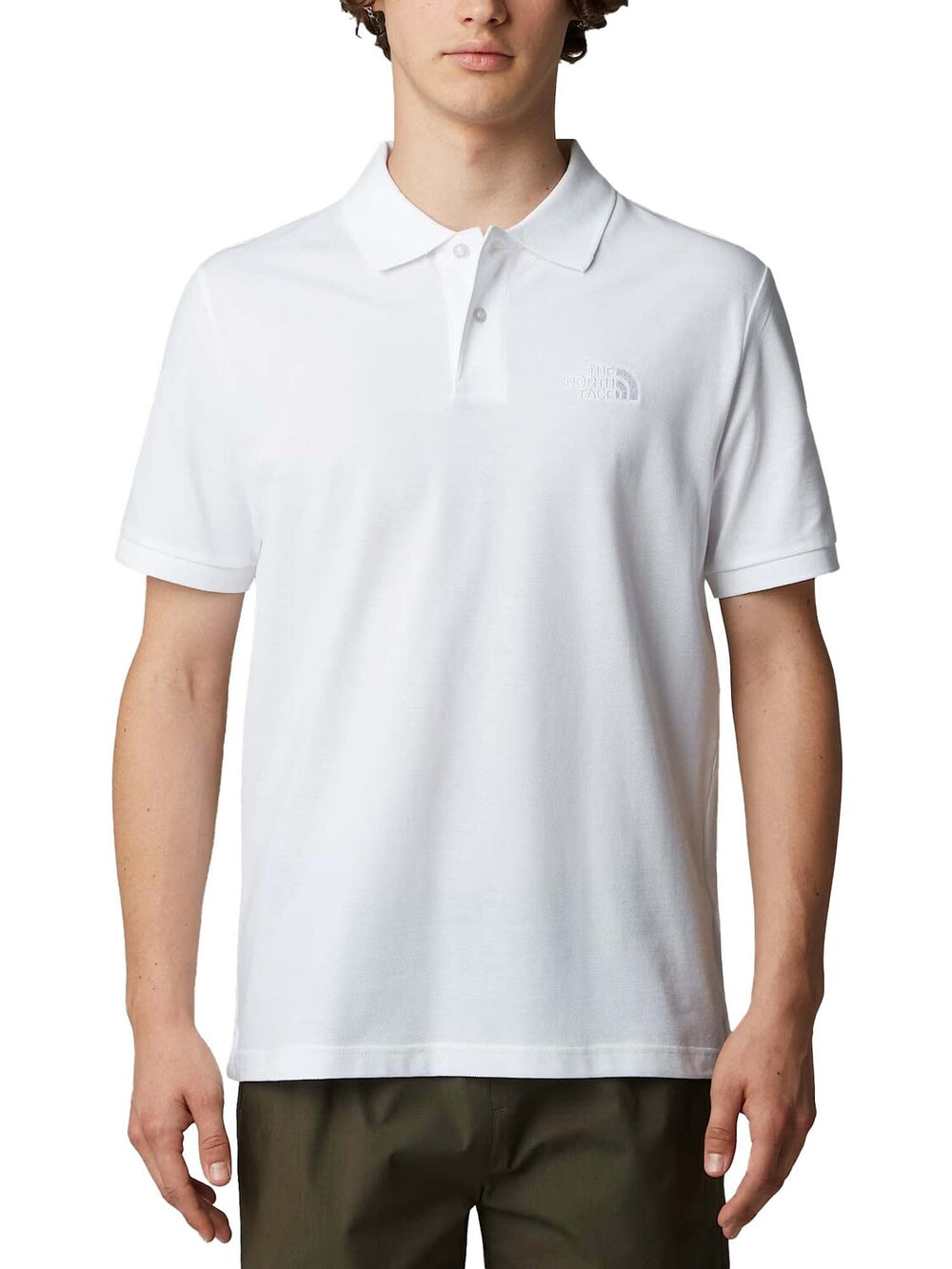 Polo uomo THE NORTH FACE con logo a rilievo nido d'ape, tessuto morbido e stile casual elegante.